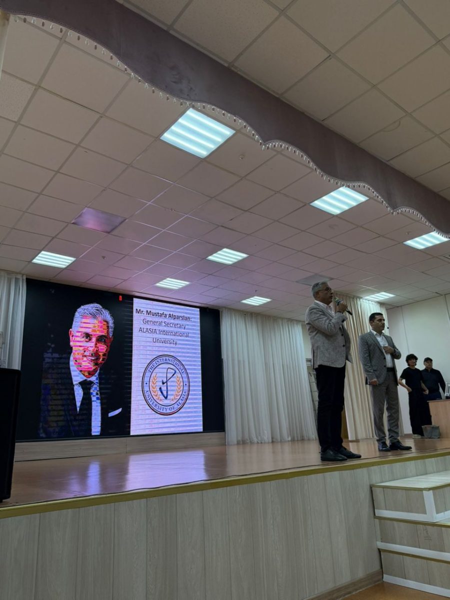 International University of Alasia delegation presenting a scholarship certificate